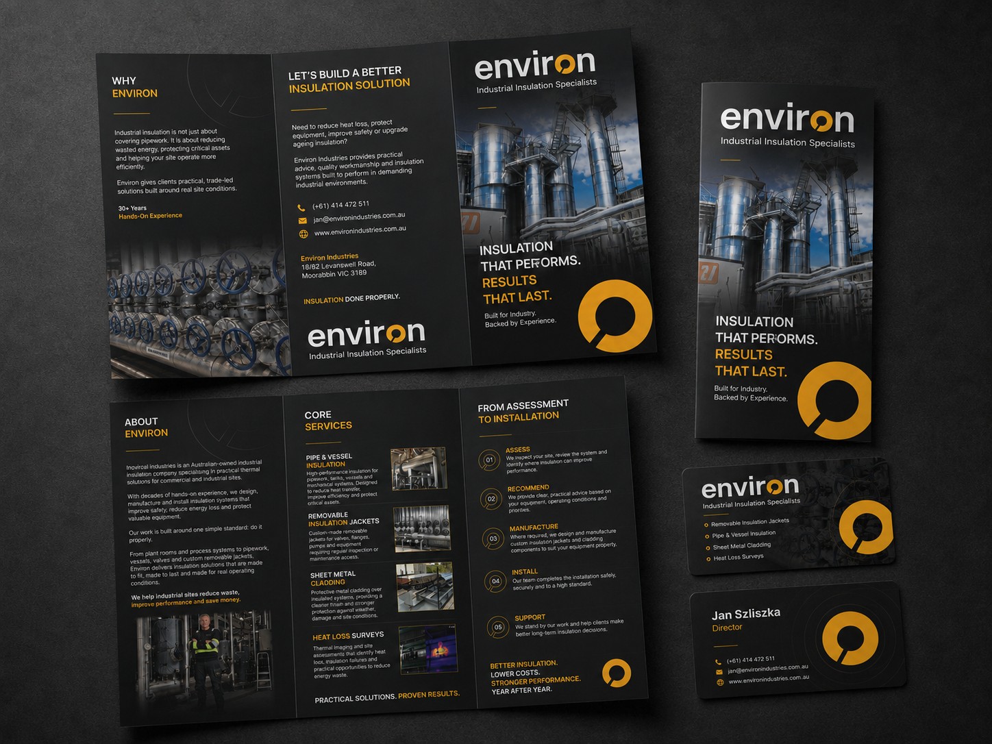 Environ Industries business card and brochure close-up showing premium black and yellow brand finish