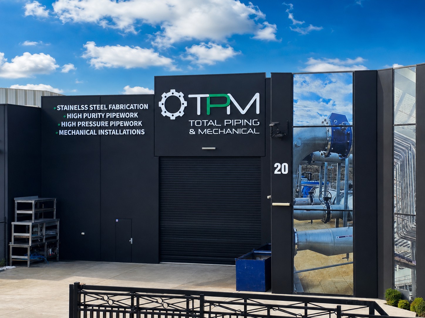 TPM workshop facade showcasing completed branded industrial signage